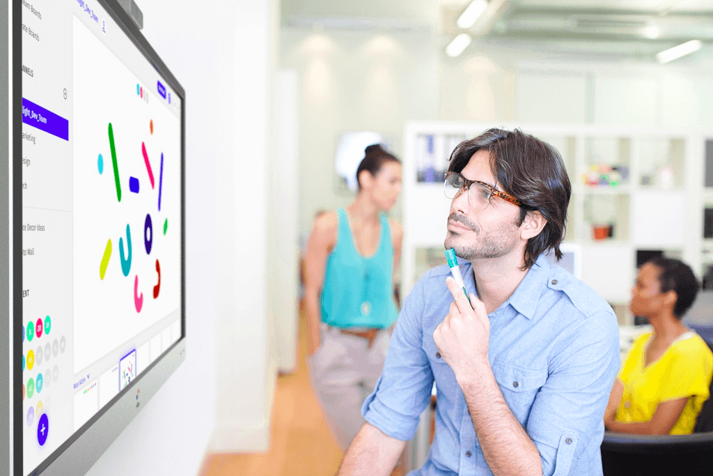 Brainstorming session in front of a Vibe interactive whiteboard.
