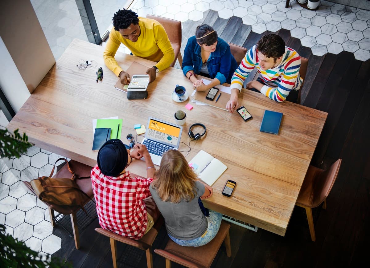 A work team gathers to generate ideas in a brainstorming session.
