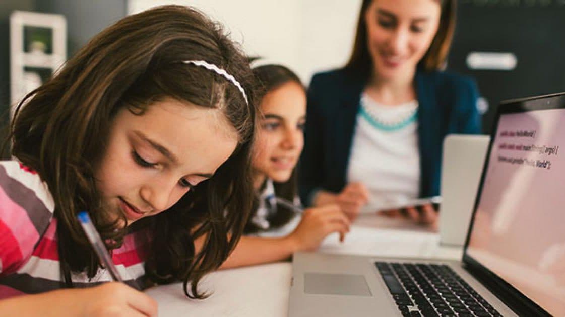 the teacher is sharing information with students in class