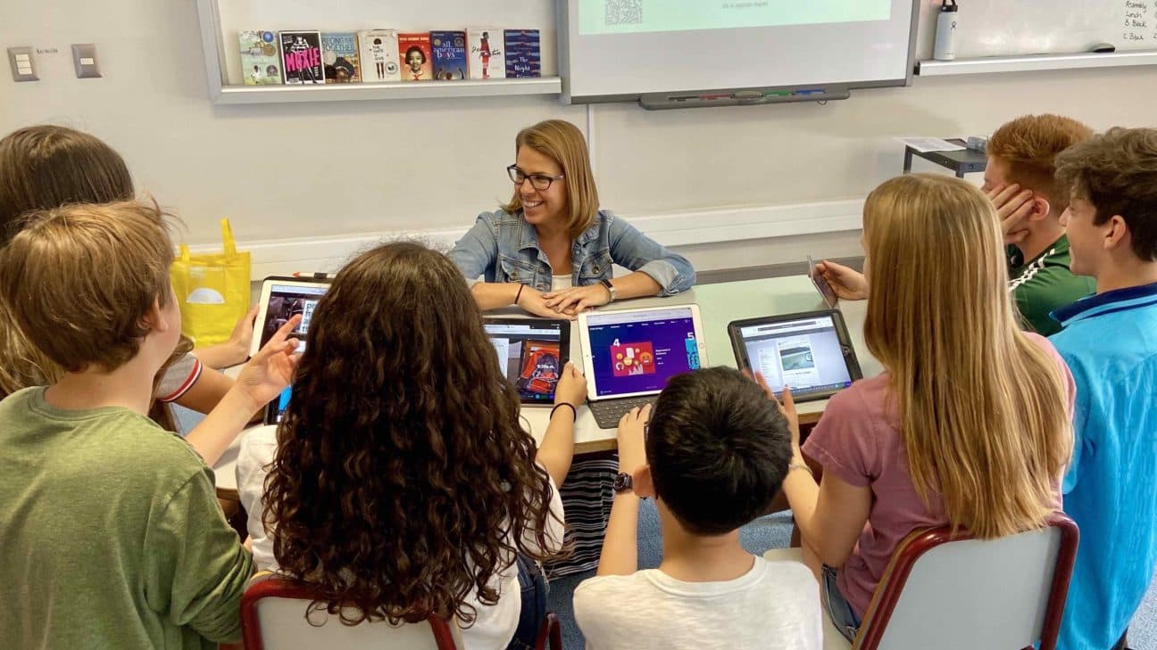Students gathered around laptops