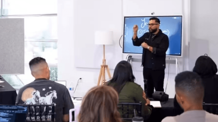 Sales professional presenting to a group using the Vibe Board S1 to deliver an interactive and engaging client pitch.