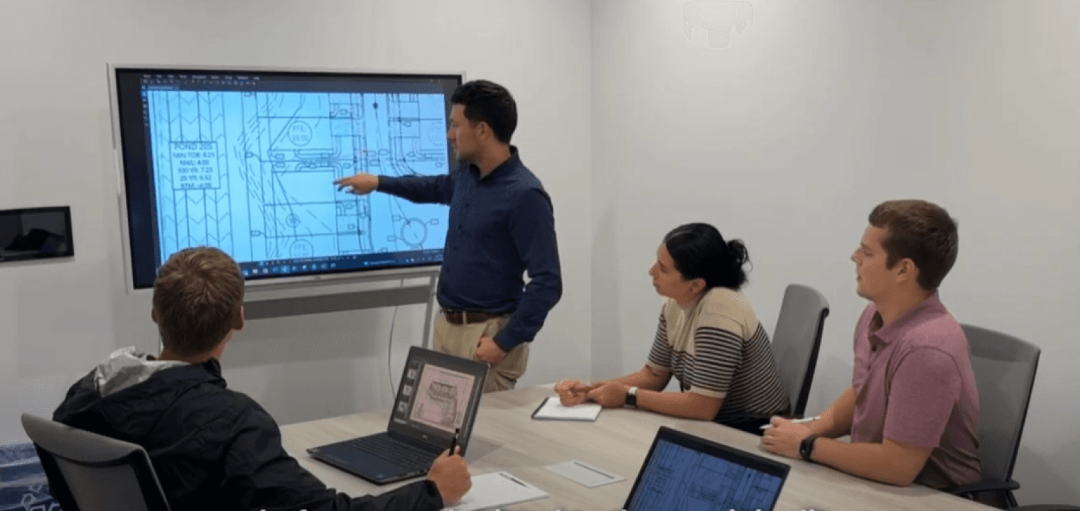 Civil engineers using a Vibe Board to streamline site research, troubleshoot designs, and collaborate seamlessly.