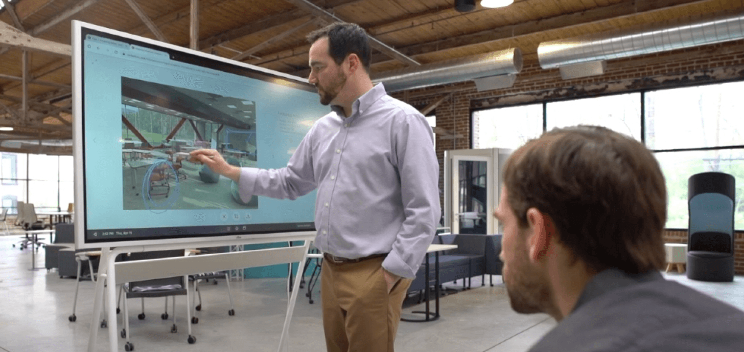 Fluxspace team annotating over a collaborative workspace rendering on the Vibe Board.